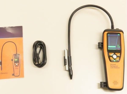 Gas detector with hose and packaging on a white background