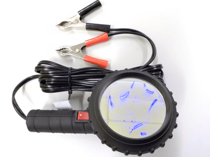 Black handheld device with blue light display and red clamps