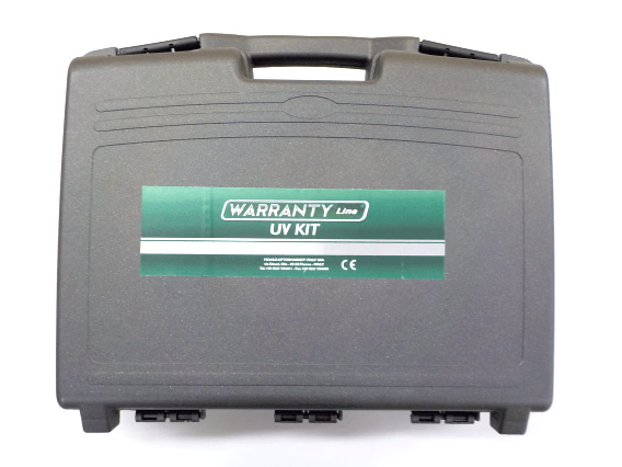 Gray carrying case with a green label for 'Warranty Line UV Kit'
