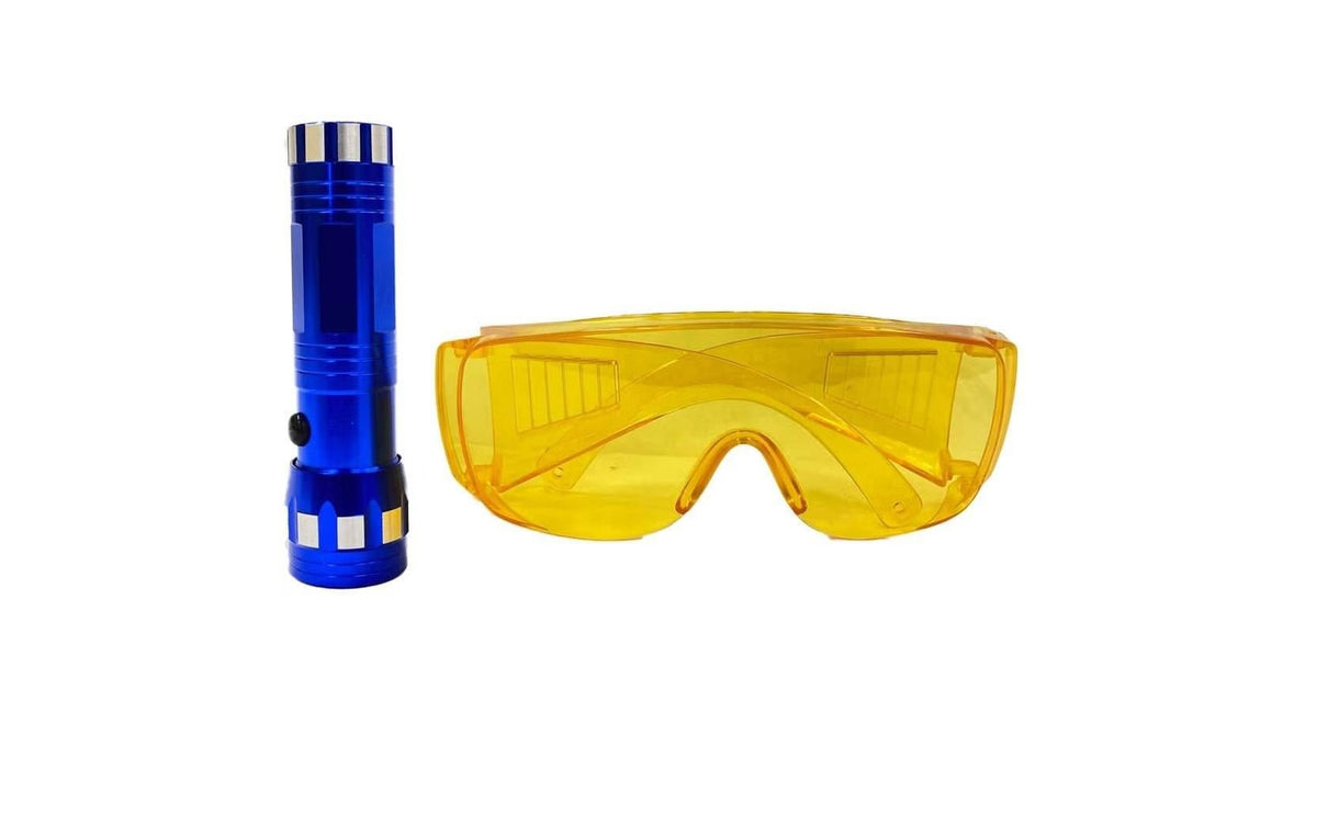 Blue flashlight and yellow goggles on a white background